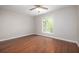 Well-lit bedroom with hardwood floors and ceiling fan at 18 Ivy Ne Rdg, Atlanta, GA 30342