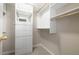 Bright walk-in closet with built-in shelving and drawers at 18 Ivy Ne Rdg, Atlanta, GA 30342