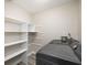 Laundry room with washer, dryer, and shelving at 18 Ivy Ne Rdg, Atlanta, GA 30342