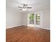 Living room with hardwood floors and access to private deck at 18 Ivy Ne Rdg, Atlanta, GA 30342