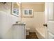 Clean bathroom, featuring a bathtub and granite countertop vanity at 5531 Wild Cherry Sw Dr, Mableton, GA 30126