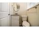 Small bathroom with white vanity, granite countertop and oval mirror at 5531 Wild Cherry Sw Dr, Mableton, GA 30126