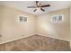 Spacious bedroom with neutral carpeting and ceiling fan at 5531 Wild Cherry Sw Dr, Mableton, GA 30126