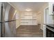 Bright dining area with hardwood floors and built-in shelving at 5531 Wild Cherry Sw Dr, Mableton, GA 30126