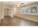 Spacious living room featuring hardwood floors and built-in shelving at 5531 Wild Cherry Sw Dr, Mableton, GA 30126