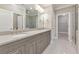 Bathroom boasts double sinks, granite countertop, and a large walk-in shower at 630 Eagles Lndg, Woodstock, GA 30188