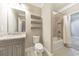 Modern bathroom with a shower/tub combo and floating shelves at 630 Eagles Lndg, Woodstock, GA 30188