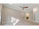 Bright bedroom with ceiling fan, neutral walls, and plush carpeting at 630 Eagles Lndg, Woodstock, GA 30188