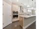 Modern kitchen with white cabinets, stainless steel appliances, and an island at 630 Eagles Lndg, Woodstock, GA 30188