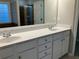 Double vanity bathroom with granite countertops at 681 Courageous Ct, Lawrenceville, GA 30043