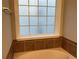 Bathroom features garden tub and large window at 681 Courageous Ct, Lawrenceville, GA 30043