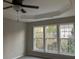 Bright bedroom with ceiling fan and large windows at 681 Courageous Ct, Lawrenceville, GA 30043