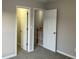 Bedroom with doors leading to closet and hallway at 681 Courageous Ct, Lawrenceville, GA 30043