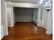 Bright dining room with hardwood floors, chandelier, and access to backyard at 681 Courageous Ct, Lawrenceville, GA 30043