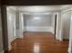 Formal dining room with hardwood floors, wainscoting, and chandelier at 681 Courageous Ct, Lawrenceville, GA 30043