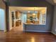 Kitchen with granite countertops, wooden cabinets and view to living room at 681 Courageous Ct, Lawrenceville, GA 30043