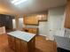 Kitchen boasts granite island and ample cabinet space at 681 Courageous Ct, Lawrenceville, GA 30043