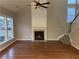 Spacious living room with hardwood floors, fireplace, and high ceilings at 681 Courageous Ct, Lawrenceville, GA 30043