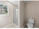 Small bathroom with shower and toilet at 2907 Wickford Nw Dr, Kennesaw, GA 30152