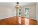 Formal dining room with hardwood floors, chandelier, and wainscoting at 2907 Wickford Nw Dr, Kennesaw, GA 30152