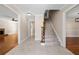 Bright entryway with tiled floors, hardwood floors, and a staircase at 2907 Wickford Nw Dr, Kennesaw, GA 30152
