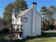Side view of a home featuring a deck with a staircase on a sunny day at 2907 Wickford Nw Dr, Kennesaw, GA 30152