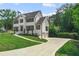 House exterior showcasing a two car garage and manicured lawn at 2907 Wickford Nw Dr, Kennesaw, GA 30152