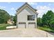 Rear exterior view of house showing two car garage at 2907 Wickford Nw Dr, Kennesaw, GA 30152