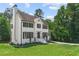 Two story house with white siding, black trim, and landscaped yard at 2907 Wickford Nw Dr, Kennesaw, GA 30152