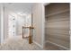 Upstairs hallway with carpet, doors to bedrooms, and a storage closet at 2907 Wickford Nw Dr, Kennesaw, GA 30152