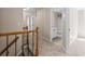Upstairs hallway with carpet and access to bedrooms and bathroom at 2907 Wickford Nw Dr, Kennesaw, GA 30152