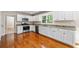 Kitchen with white cabinets, granite countertops, and stainless steel appliances at 2907 Wickford Nw Dr, Kennesaw, GA 30152