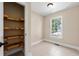 Walk-in pantry with custom wooden shelving at 2907 Wickford Nw Dr, Kennesaw, GA 30152