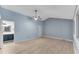 Bedroom with light blue walls, ceiling fan and laminate wood floors at 4234 Stillwater Dr, Duluth, GA 30096