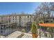 Relaxing balcony with neighborhood views and potted plants at 98 Ardmore Nw Pl # 3, Atlanta, GA 30309