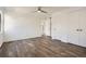 Well-lit bedroom with wood-look flooring, double closets and a ceiling fan at 98 Ardmore Nw Pl # 3, Atlanta, GA 30309