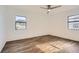 Spacious bedroom with wood-look flooring, ceiling fan and large windows at 98 Ardmore Nw Pl # 3, Atlanta, GA 30309