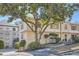 Building exterior showcasing landscaping and a tree at 98 Ardmore Nw Pl # 3, Atlanta, GA 30309