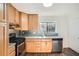 Kitchen with light wood cabinets, stainless steel appliances, and granite countertops at 98 Ardmore Nw Pl # 3, Atlanta, GA 30309