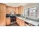 Modern kitchen with light wood cabinets and stainless steel appliances at 98 Ardmore Nw Pl # 3, Atlanta, GA 30309