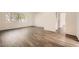 Living room with wood-look floors and access to other rooms at 98 Ardmore Nw Pl # 3, Atlanta, GA 30309