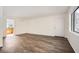 Living room with wood-look floors and ample natural light at 98 Ardmore Nw Pl # 3, Atlanta, GA 30309