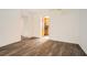 Open living room with wood-look floors and a view of the kitchen at 98 Ardmore Nw Pl # 3, Atlanta, GA 30309
