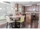 Kitchen with dark wood cabinets, granite counters and an island at 15 Blanket Pass, Covington, GA 30016