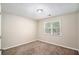 Simple bedroom with neutral walls and carpet at 6602 Crossing Creek Pt, Austell, GA 30168