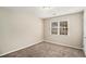 Bright bedroom with neutral walls and carpet at 6602 Crossing Creek Pt, Austell, GA 30168