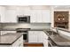 Modern kitchen with granite countertops and stainless steel appliances at 1983 Silver Birch Se Dr, Smyrna, GA 30080