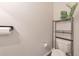 Small bathroom with toilet and shelving unit at 1017 Rohner Way, Smyrna, GA 30080