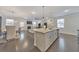 Open concept kitchen with island, granite countertops and stainless steel appliances at 1017 Rohner Way, Smyrna, GA 30080