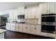 Modern kitchen with stainless steel appliances and granite countertops at 611 Taymack W, Woodstock, GA 30188